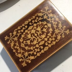 Vintage wooden box gold inlay filigree detailing on top music box